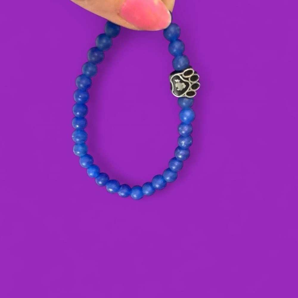 Blue beaded bracelet with animal paw detail